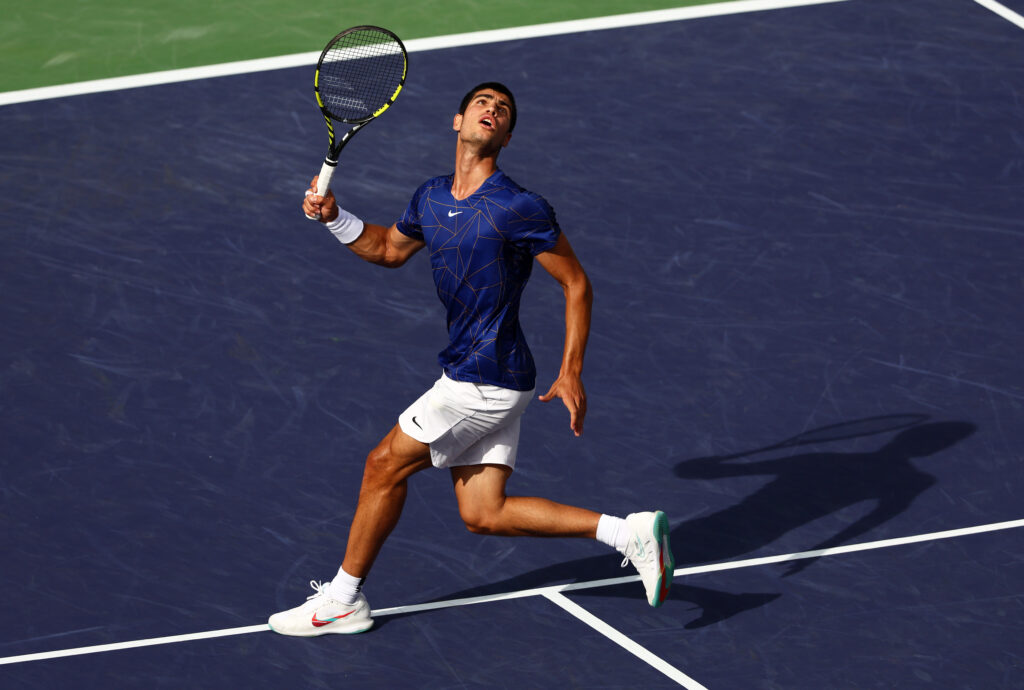 Carlos Alcaraz in action against Rafael Nadal at Indian Wells in 2022