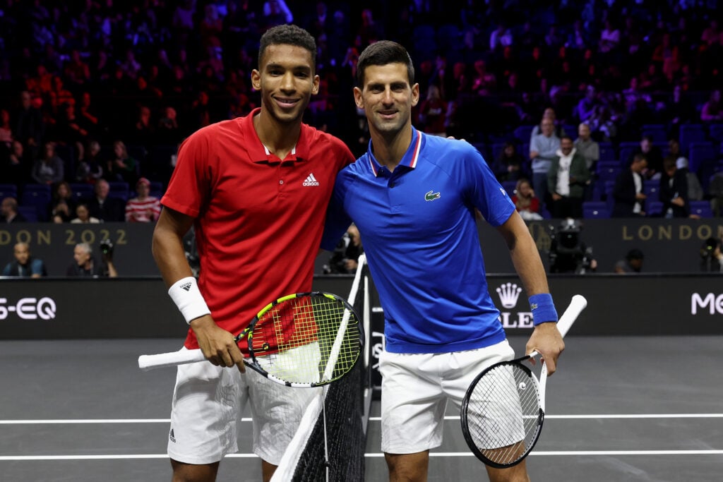 Felix Auger-Aliassime and Novak Djokovic pose for a picture ahead of their match at the 2022 Laver Cup.