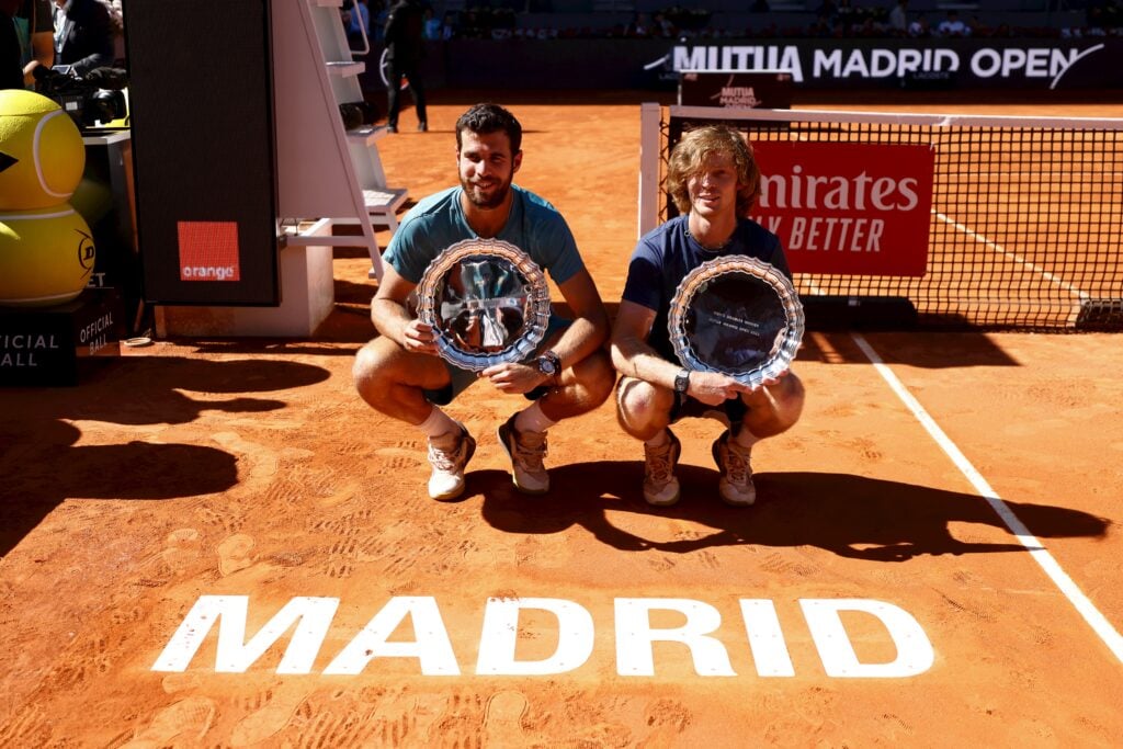 Karen Khachanov and Andrey Rublev celebrate after winning the 2023 Madrid Open