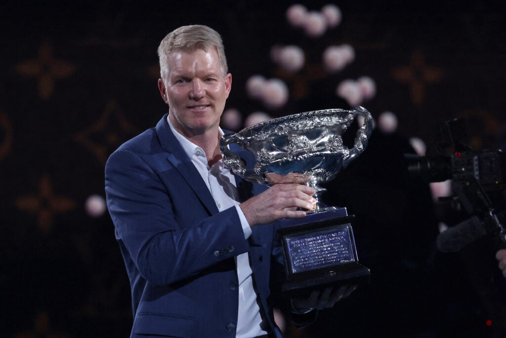 Jim Courier holds the Australian Open trophy in 2024