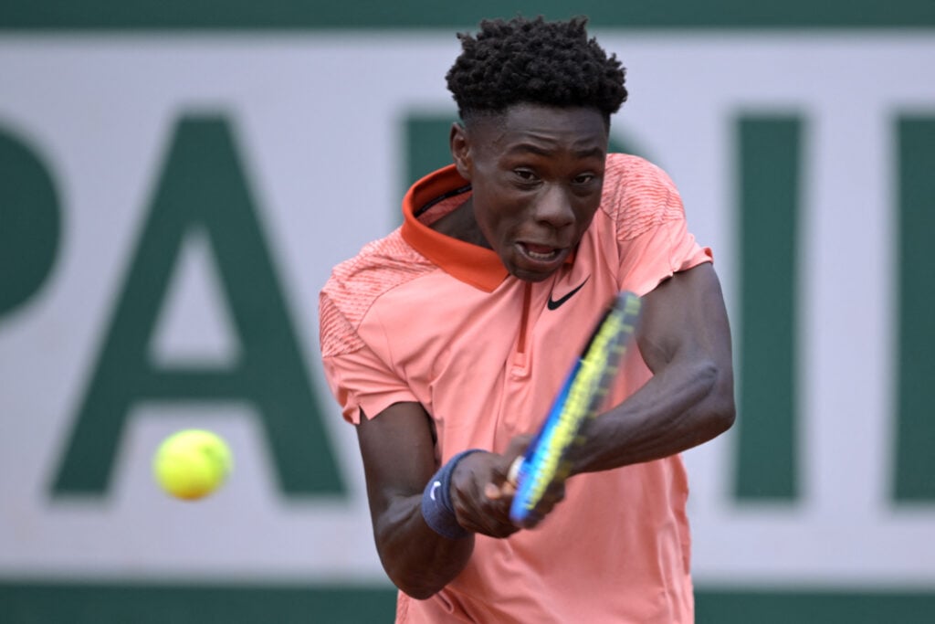 Moise Kouame hits a backhand at the 2024 French Open junior tournament.