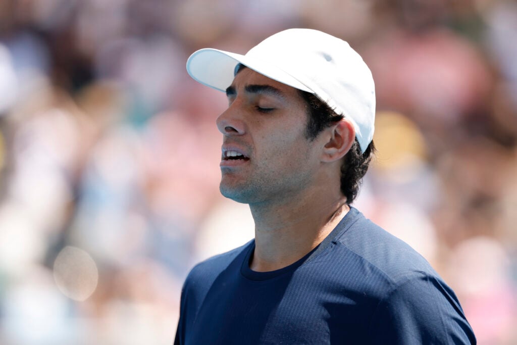 Cristian Garin appears dejected in his first round match at the 2026 Australian Open against Luciano Darderi.