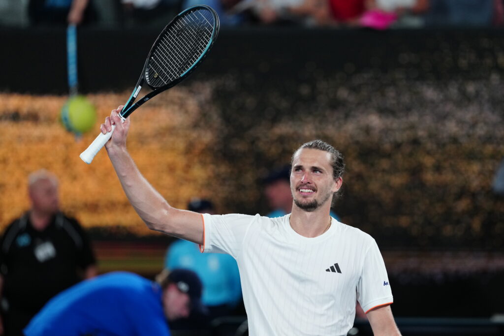 Alexander Zverev waves to the crowd and smiles.