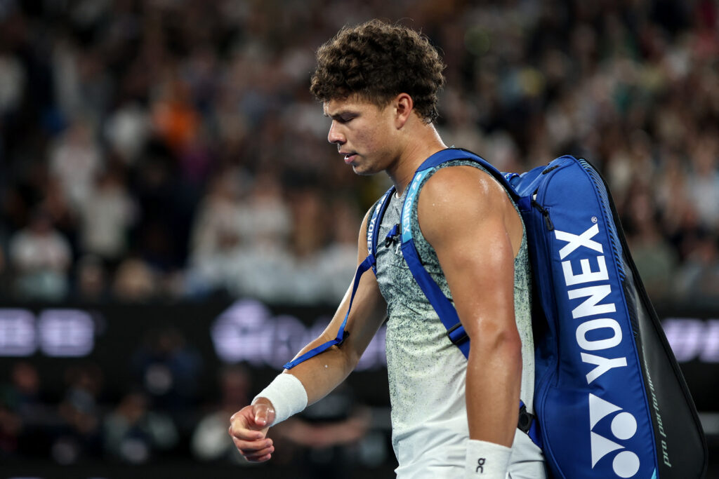 Ben Shelton walks off court after losing to Jannik Sinner at the 2026 Australian Open.