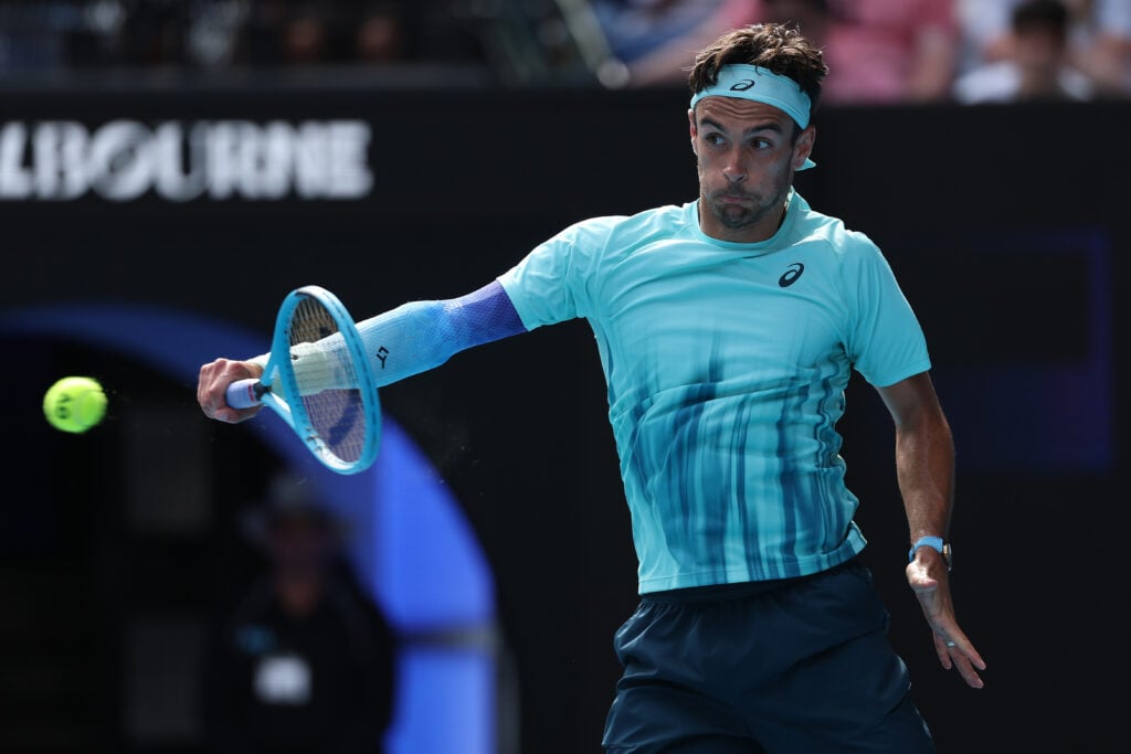 Lorenzo Musetti hitting a backhand.