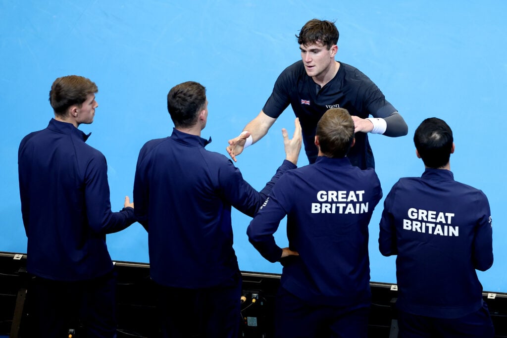 Jack Draper celebrates with his team after winning at the Davis Cup.