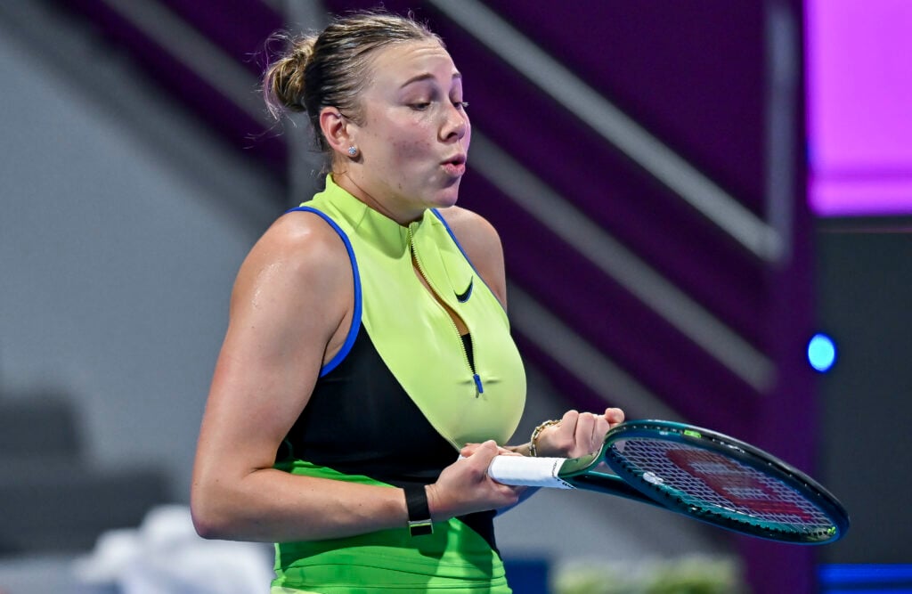 Amanda Anisimova expresses frustration during her first round match at the 2026 Qatar Open against Karolina Pliskova.