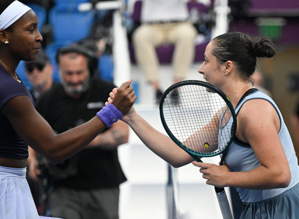 Coco Gauff shakes hands with Elisabetta Cocciaretto after being beaten at the 2026 Qatar Open.