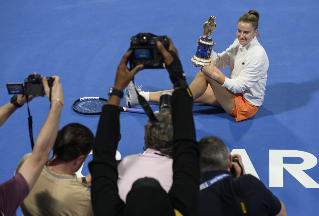 Karolina Muchova poses with the Qatar Open title.