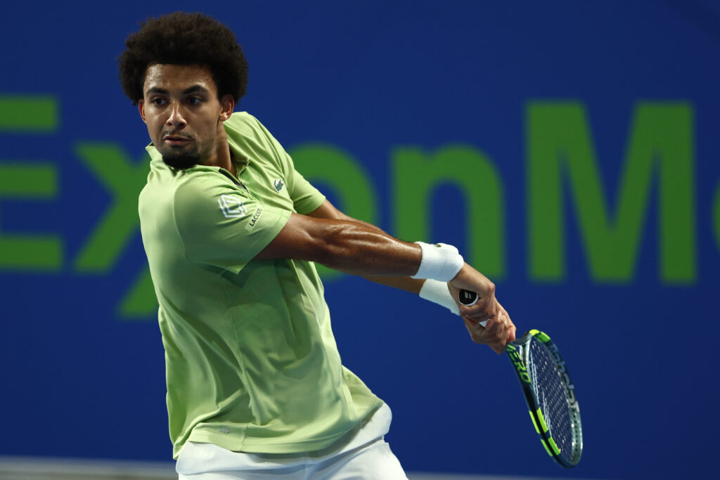 Arthur Fils plays a backhand against Kamil Majchrzak at the 2026 Qatar Open.