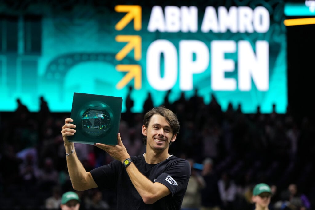 Alex de Minaur poses with the Rotterdam trophy