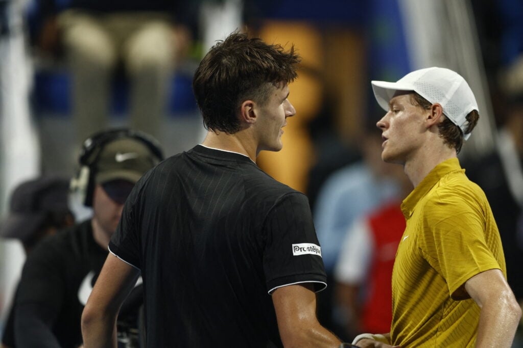 Jakub Mensik and Jannik Sinner embrace after their match at the 2026 Qatar Open