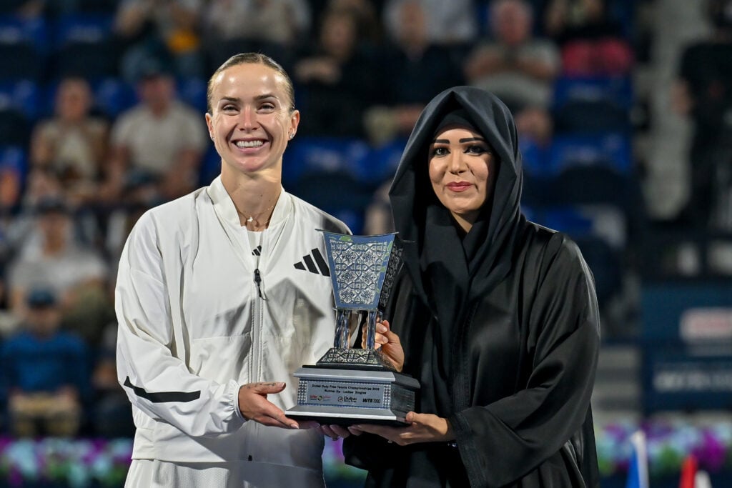 Elina Svitolina poses with the trophy after losing to Jessica Pegula in the 2026 Dubai Tennis Championships final.