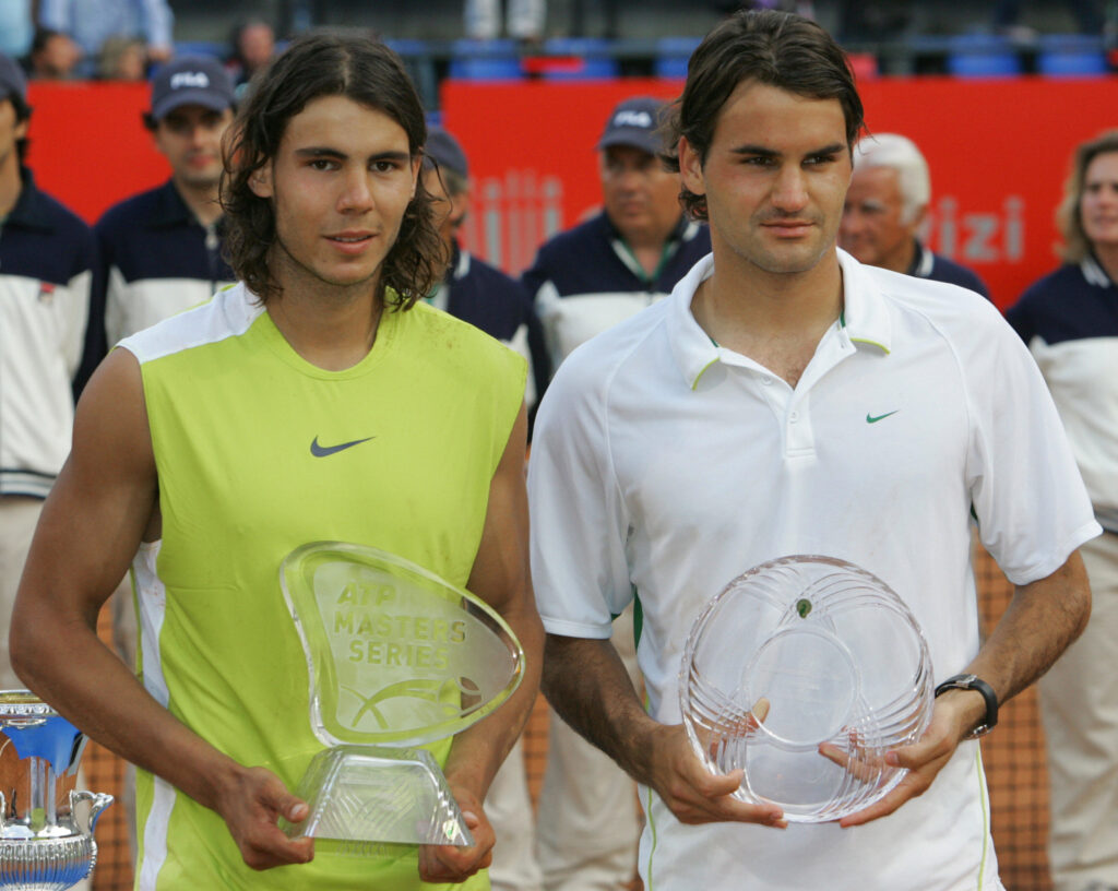 Rafael Nadal and Roger Federer pose with their trophies after the 2006 Italian Open final.
