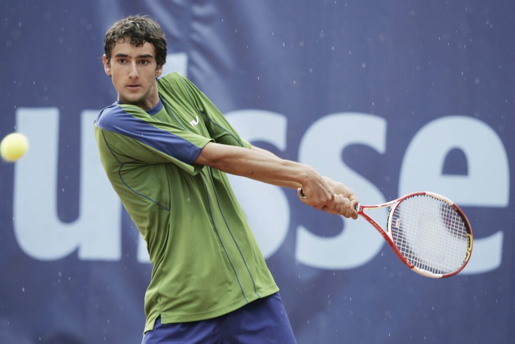 Marin Cilic plays a backhand against Andrei Pavel at the 2006 Suisse Open.