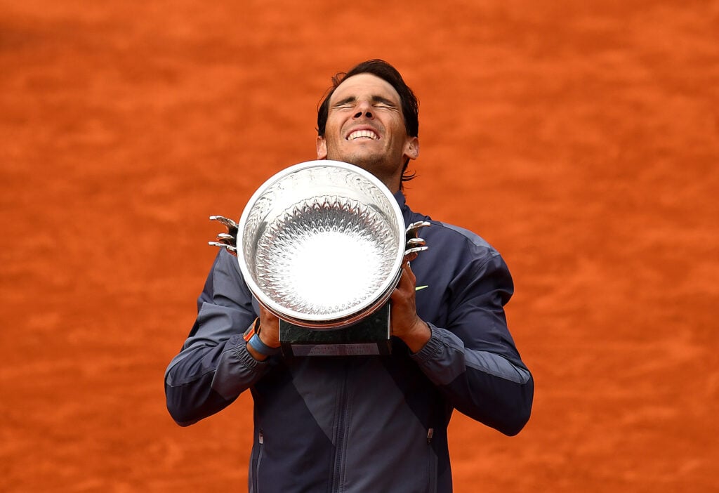 Rafael Nadal holds the 2019 Roland Garros trophy.