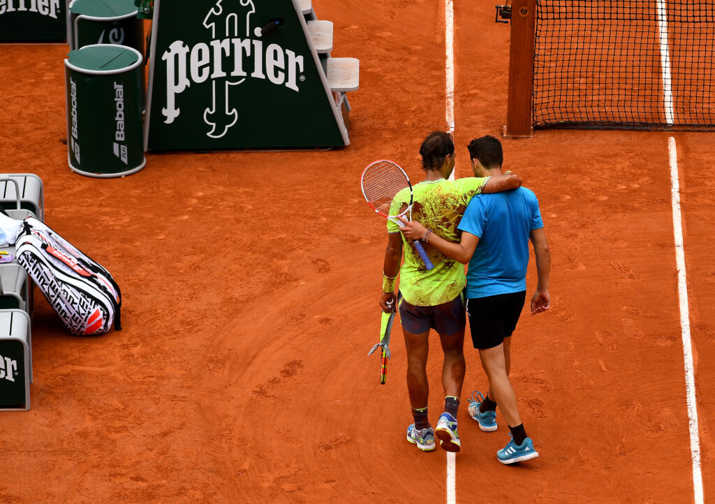 Rafael Nadal and Dominic Thiem embrace.
