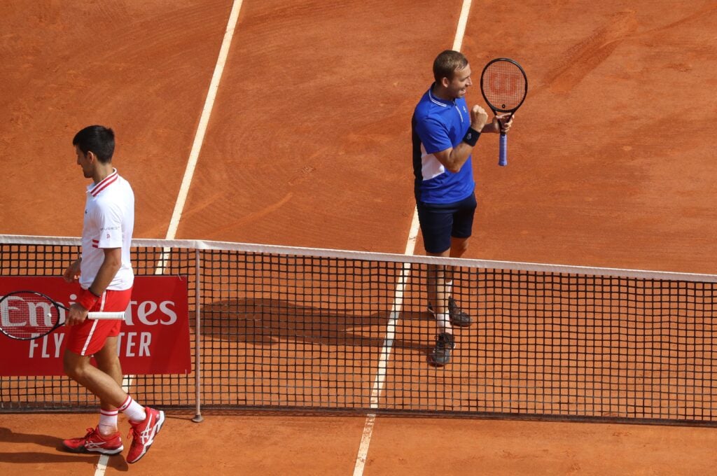 Dan Evans celebrates after beating Novak Djokovic at the Monte-Carlo Masters.
