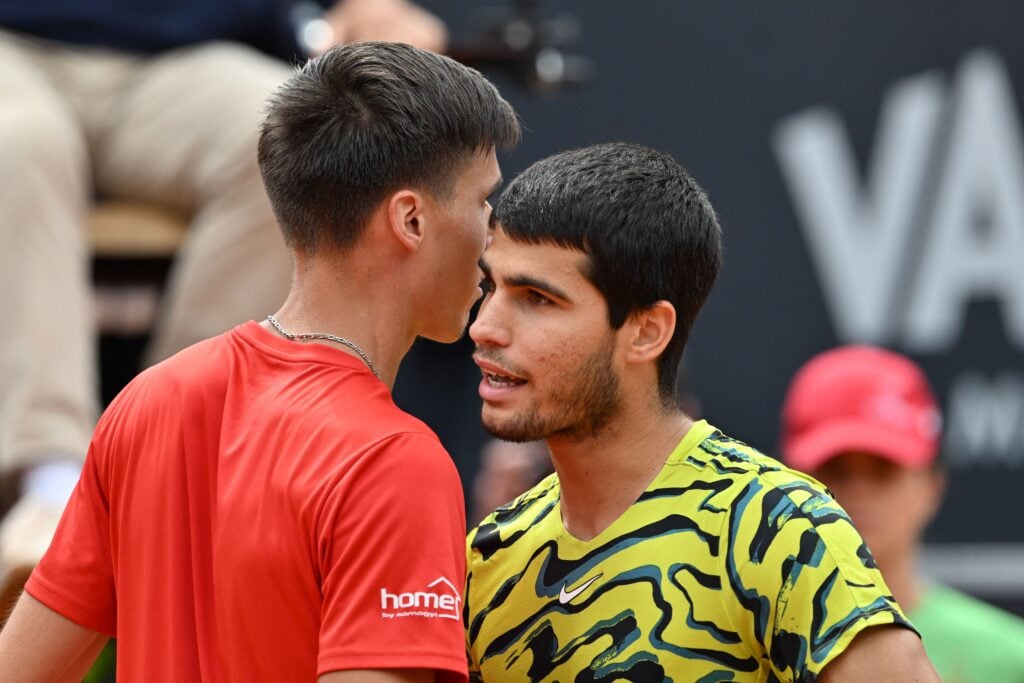 Fabian Marozsan hugs Carlos Alcaraz after beating him at the 2023 Italian Open.