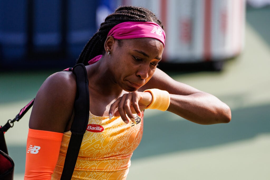 Coco Gauff leaves the court in tears after retiring against Marie Bouzkova at the 2022 Cincinnati Open.