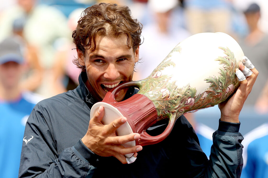 Rafael Nadal posing with the trophy after winning the 2013 Cincinnati Open title.