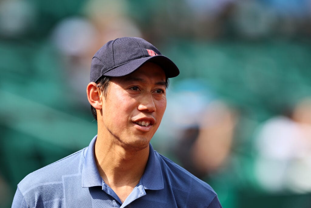 Kei Nishikori looks on during his match against Lorenzo Musetti at the 2025 U.S. Men's Clay Court Championships.