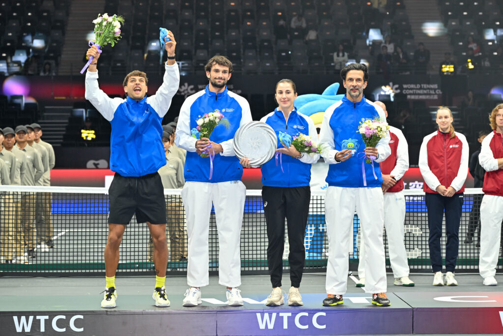 Flavio Cobolli, Valentin Vacherot, Belinda Bencic pose with their trophy at the 2025 World Tennis Continental Cup in Shenzhen, China.