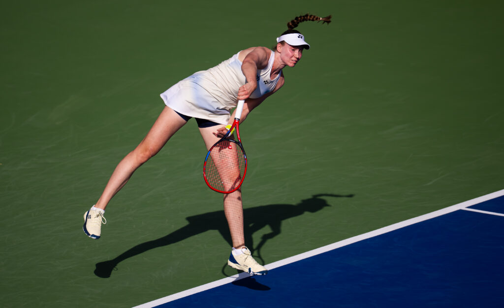 Elena Rybakina hits a serve at the 2026 Dubai Tennis Championships.