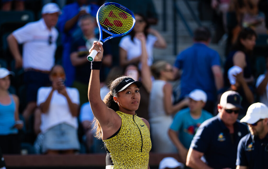 Naomi Osaka waves to the crowd after beating Camila Osorio at Indian Wells in 2026.