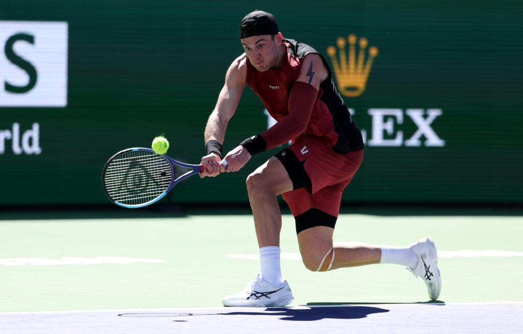 Jack Draper hits a backhand against Roberto Bautista Agut at Indian Wells in 2026.