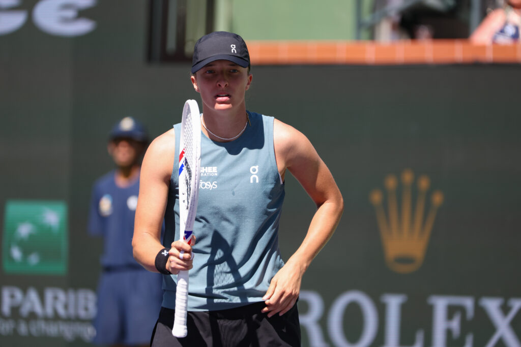 Iga Swiatek reacts after winning a point against Karolina Muchova at Indian Wells in 2026.