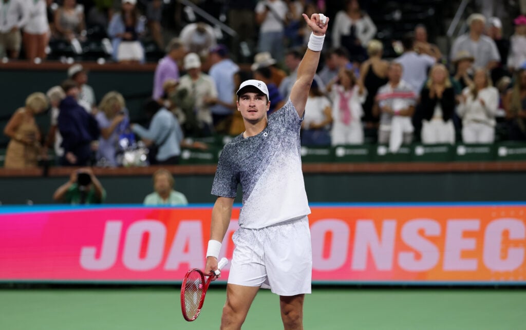 Joao Fonseca waves to the crowd after beating Tommy Paul at Indian Wells in 2026.