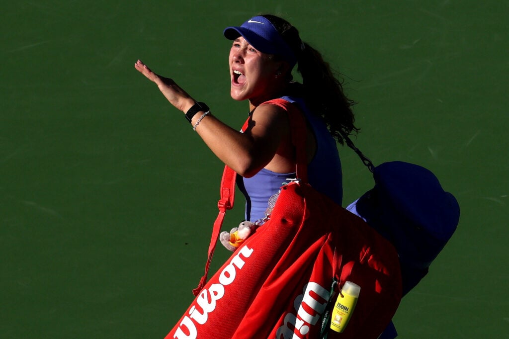 Mirra Andreeva reacts to the crowd when leaving the court after losing to Katerina Siniakova at Indian Wells in 2026.