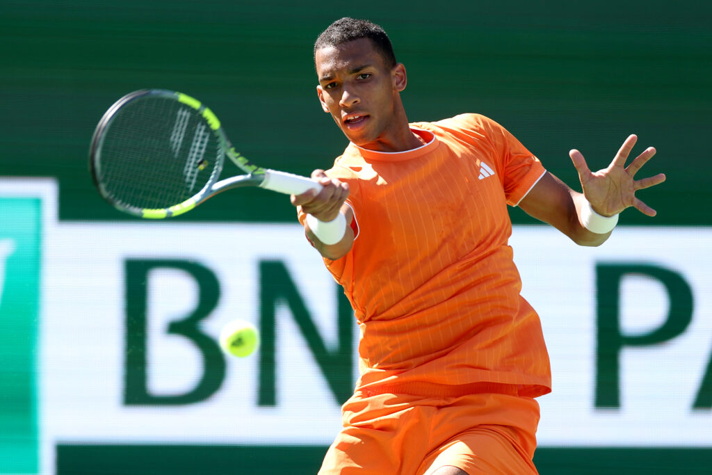 Felix Auger-Aliassime hits a forehand at Indian Wells in 2026.