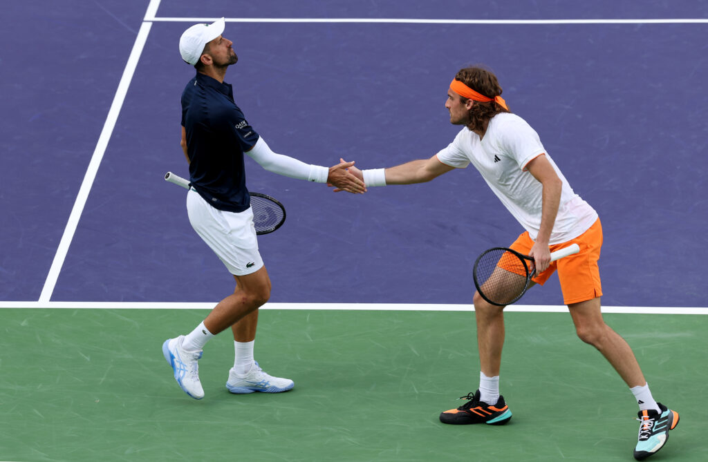 Novak Djokovic and Stefanos Tsitsipas during their doubles match at Indian Wells in 2026.