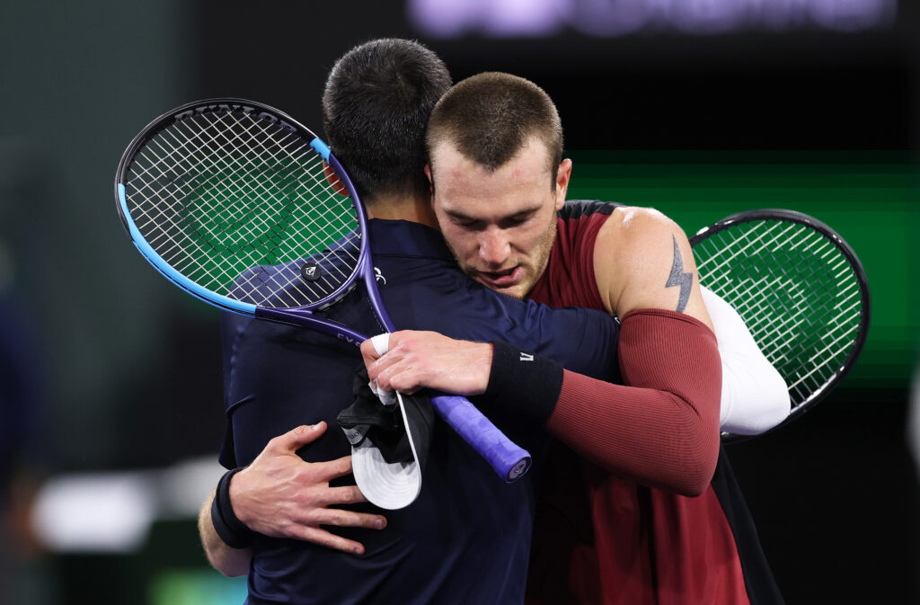 Jack Draper hugs Novak Djokovic after beating him at Indian Wells in 2026.