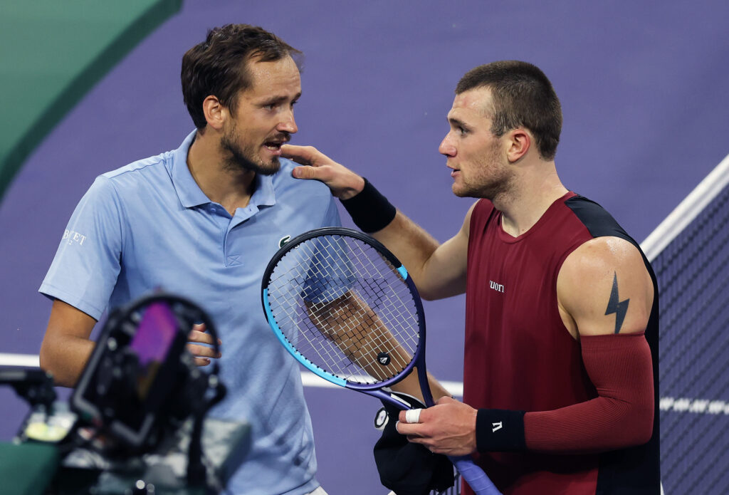 Daniil Medvedev and Jack Draper exchanging words at the net after their match at Indian Wells in 2026.