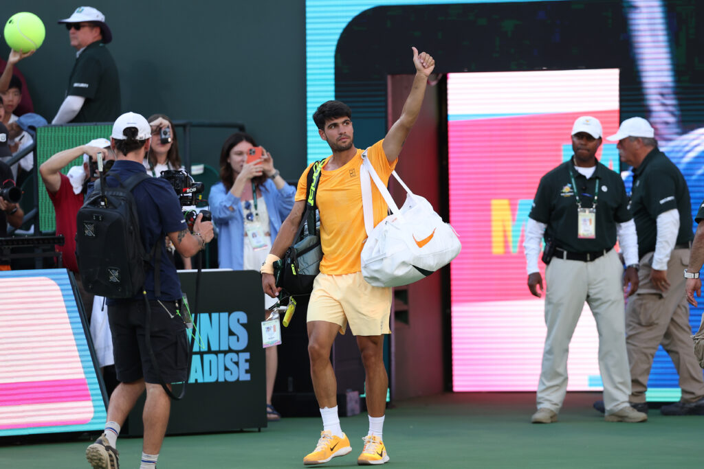 Carlos Alcaraz waves to the crowd after losing to Daniil Medvedev at Indian Wells in 2026.