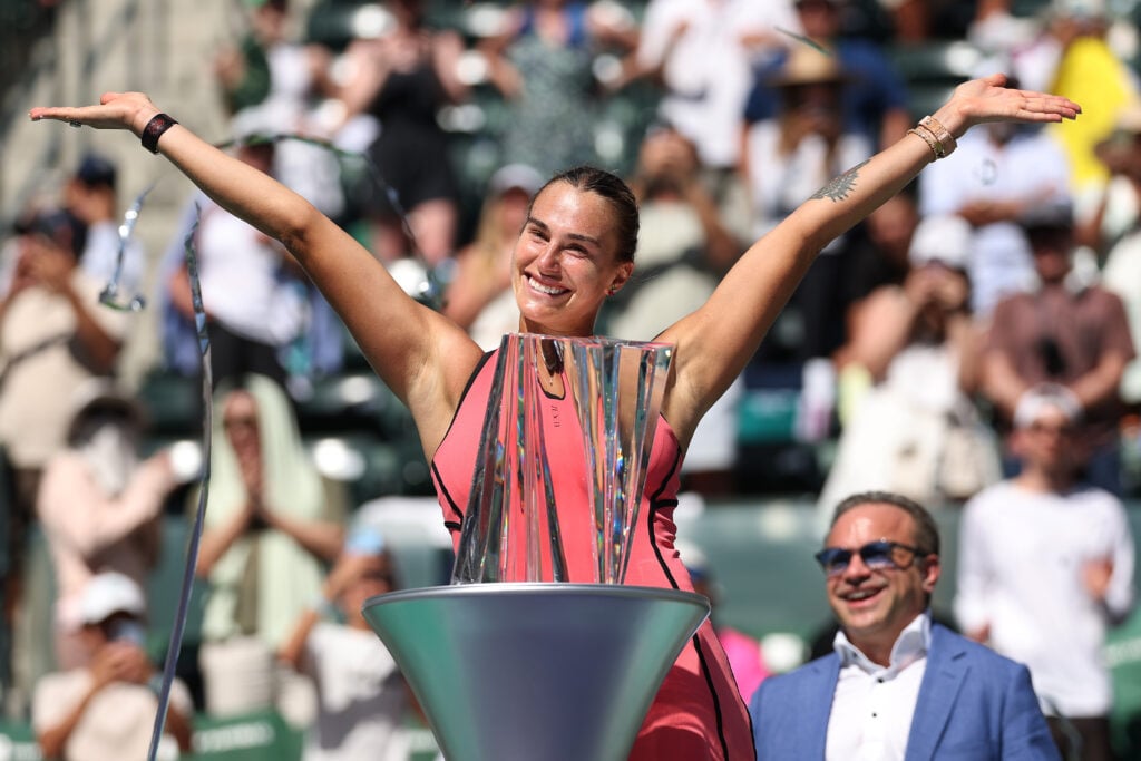 Aryna Sabalenka poses with the Indian Wells trophy after beating Elena Rybakina in the 2026 final.