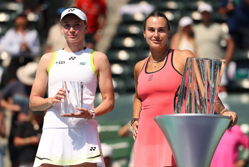 Elena Rybakina and Aryna Sabalenka pose with their respective trophies after the 2026 Indian Wells final.