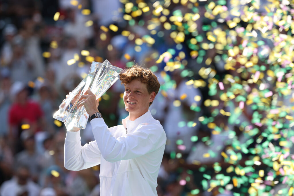 Jannik Sinner celebrates with the trophy after beating Daniil Medvedev in the 2026 Indian Wells final.