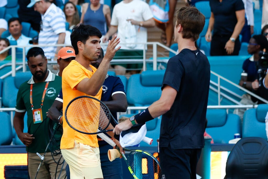 Carlos Alcaraz shakes Sebastian Korda's hand after being beaten at the 2026 Miami Open.