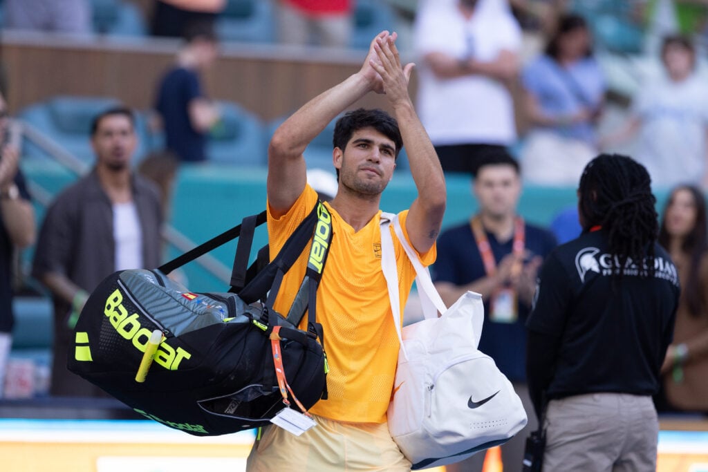 Carlos Alcaraz waves to the crowd after his defeat to Sebastian Korda at the 2026 Miami Open.