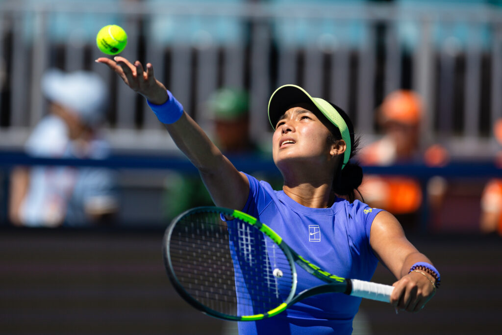 Alexandra Eala hitting a serve at the 2026 Miami Open.