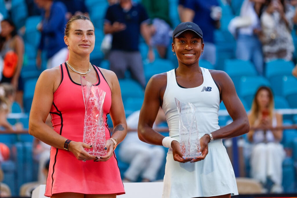 Aryna Sabalenka and Coco Gauff with their respective trophies after the 2026 Miami Open final.