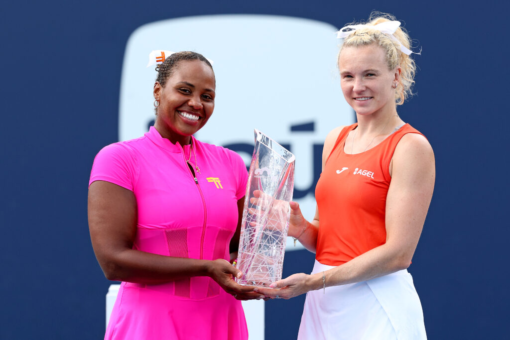 Taylor Townsend and Katerina Siniakova pose with the trophy after winning the 2026 Miami Open women's doubles title.