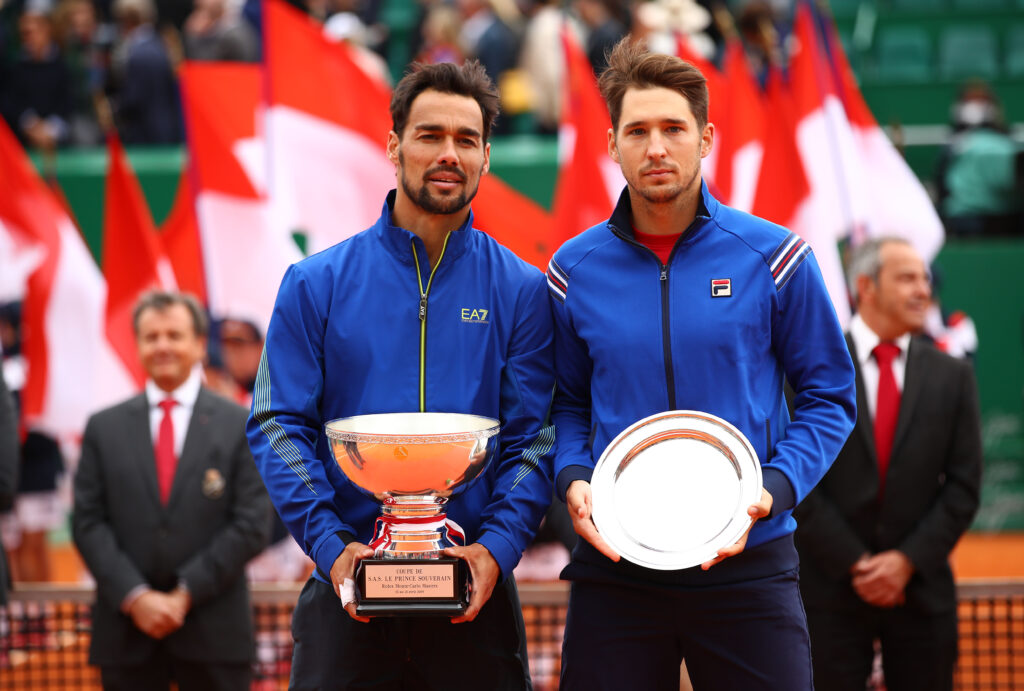 Fabio Fognini and Dusan Lajovic pose with their trophies after the 2019 Monte Carlo Masters final.