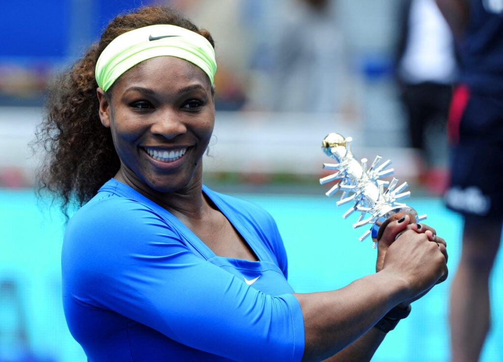 Serena Williams poses with the Madrid Open trophy after winning the 2012 title.