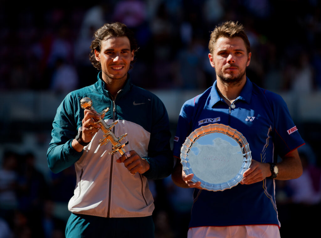 Rafael Nadal and Stan Wawrinka pose with their respective trophies after the final of the 2013 Madrid Open.
