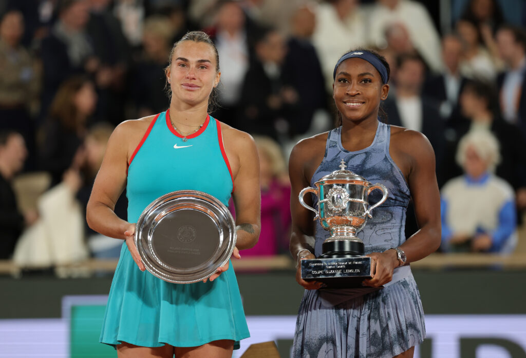 Aryna Sabalenka and Coco Gauff pose with their trophies after the 2025 French Open final.